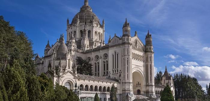 The magnificent Basilique Sainte-Thérèse is a must-see on your drive to Cherbourg