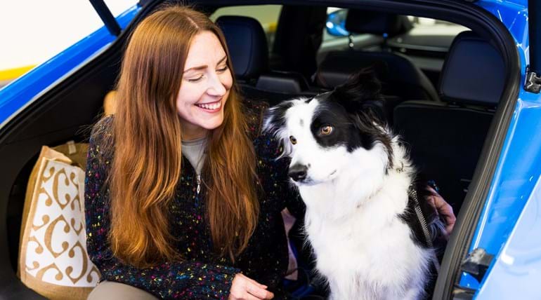 Lady and dog in car