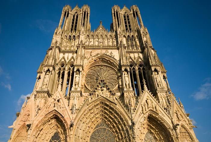  Gaze in wonder at the awe-inspiring Cathédrale Notre Dame in Reims.